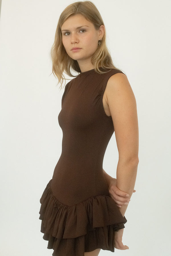 From Belle the Label, a dress that balances structure with tension. 
