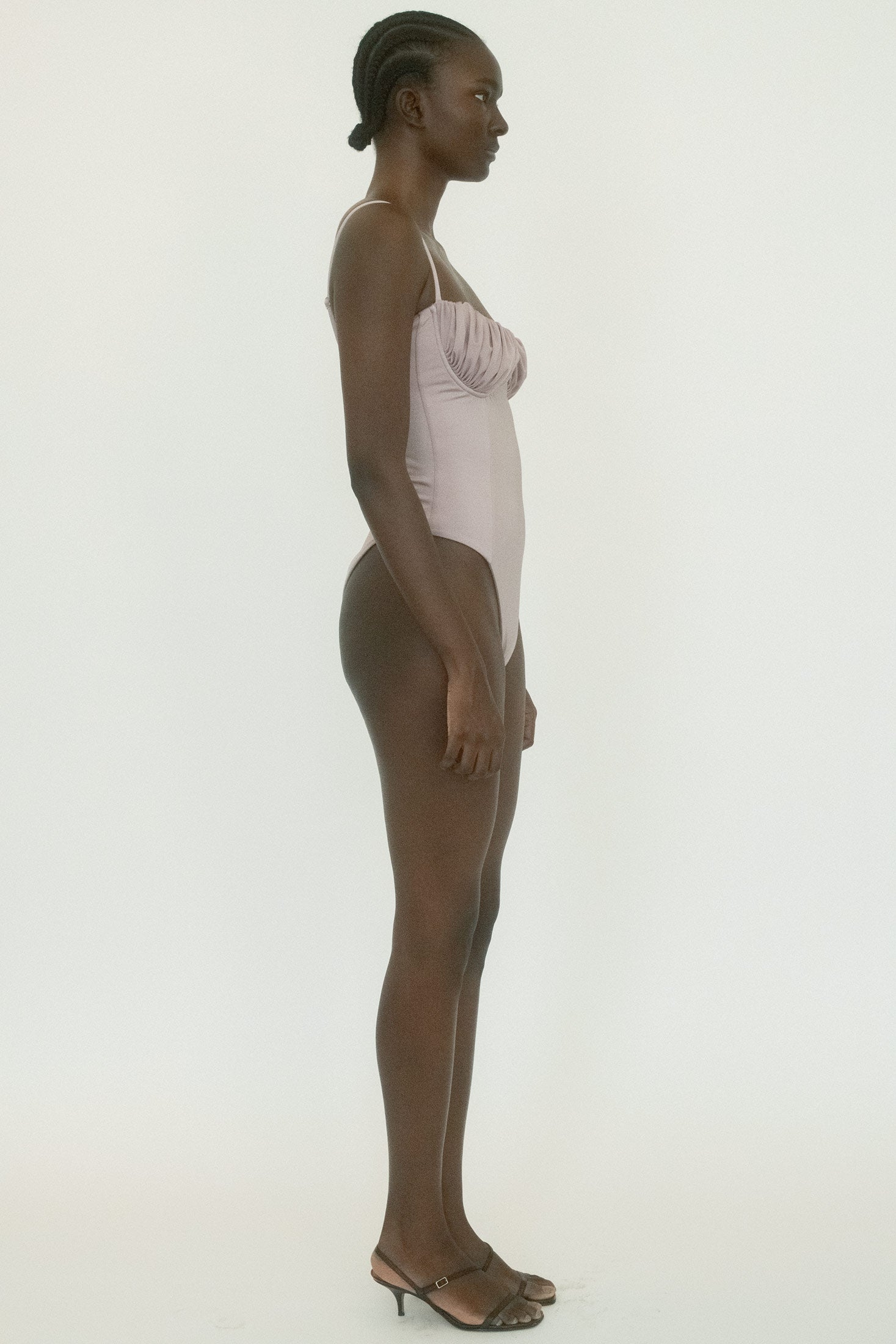 The result is swimwear written in the language of suspense, its lines clean, its presence unforgettable.