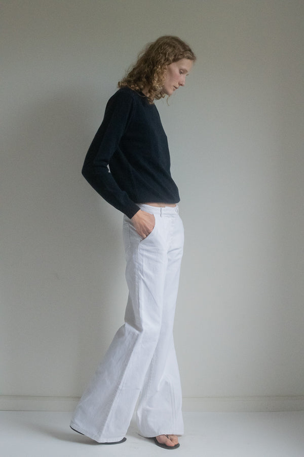 Step into the allure of cinematic elegance with Balenciaga's Vintage Wide Leg Trousers—a timeless piece that captures the essence of sophistication with a touch of individual peculiarity. 
