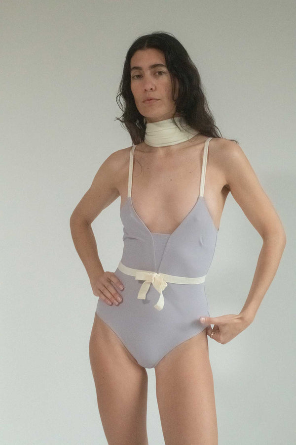 Dive into timeless elegance with Roxana Salehoun's Lilac One Piece Swimsuit—a cinematic masterpiece that captures the essence of seaside allure with a unique and striking twist. 