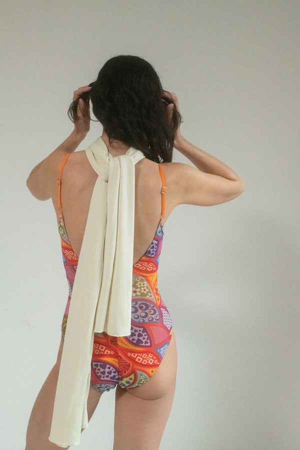 Dive into a world of retro allure and vibrant energy with our Multi-Color Psychedelic Print Scoop Back One Piece by Roxana Salehoun.
