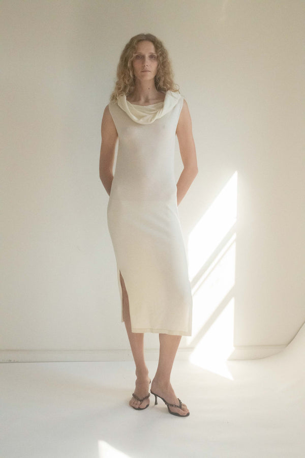 Step into a world of timeless sophistication with the Gianfranco Ferre Knit Dress, a stunning cream piece that captures the essence of modern glamour. 