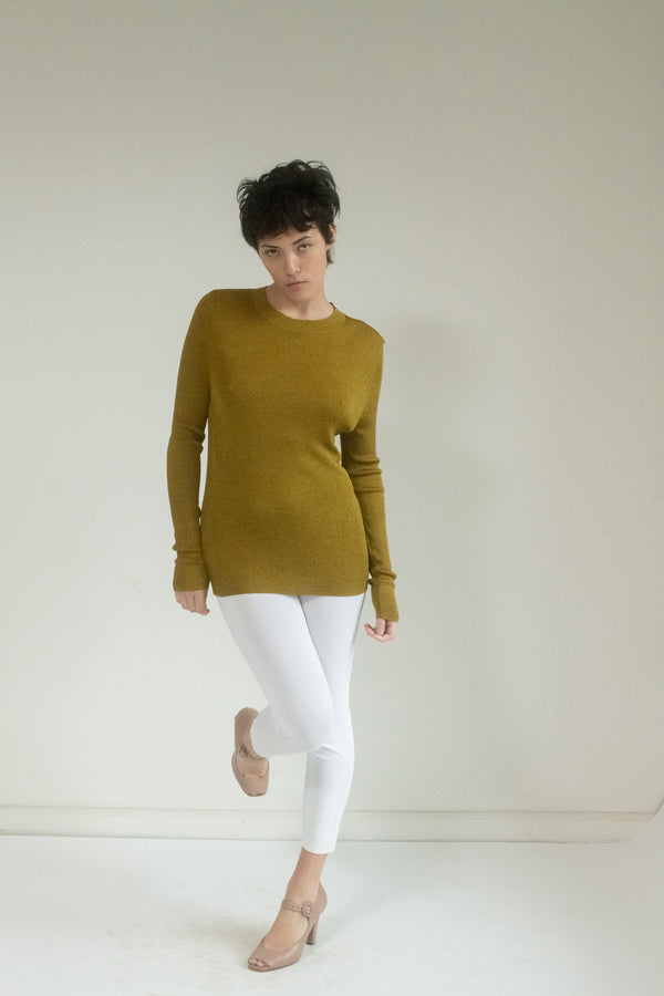 Step into the spotlight with the Judy Turner scoop sweater, a piece that embodies the art of effortless elegance.