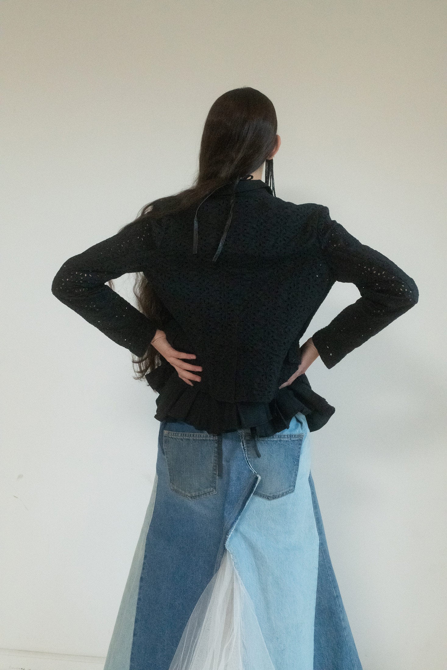 Two front pockets sit like punctuation marks—there, but only just. 