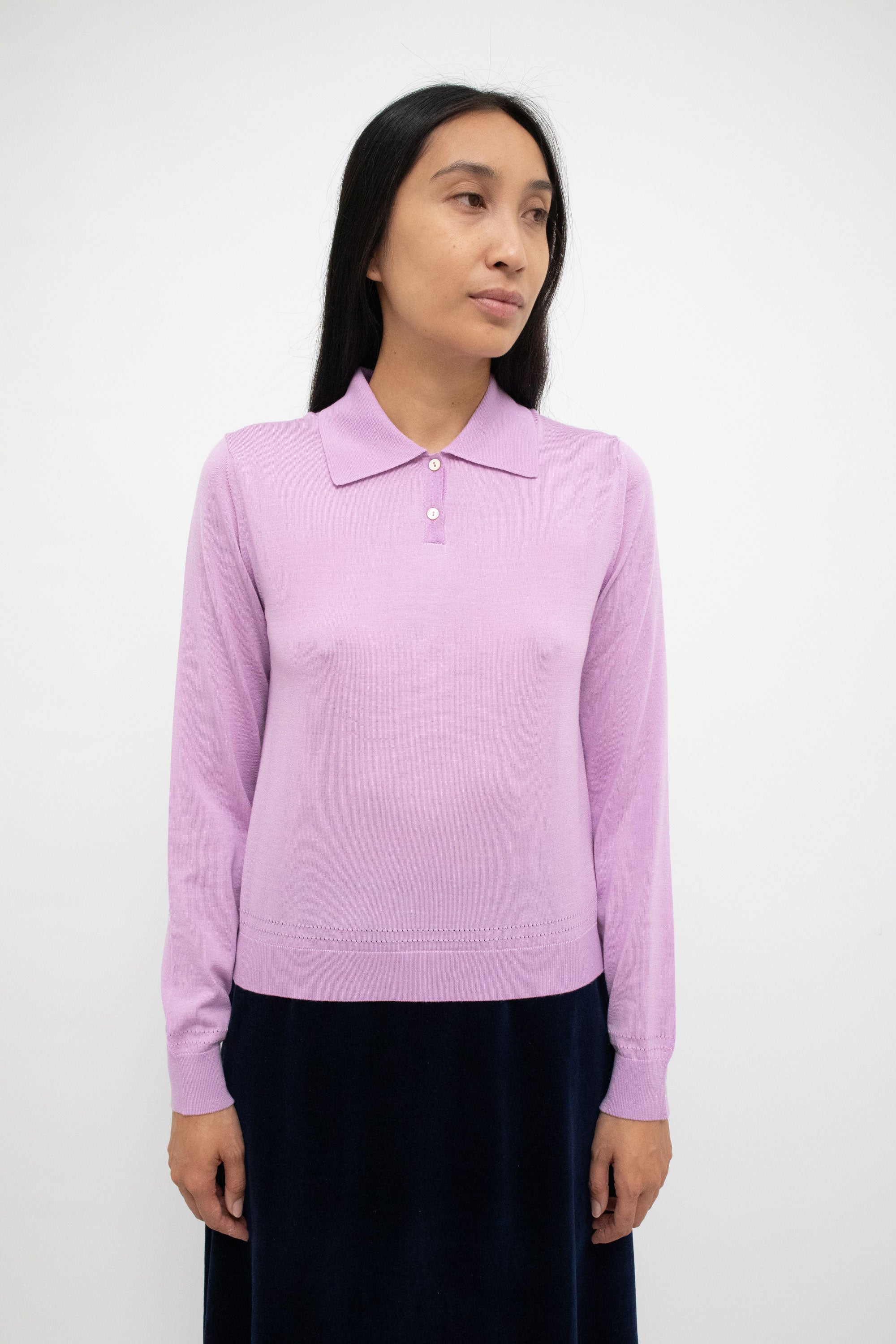 Mother of pearl buttons, each whispering tales of oceanic secrets, adorn this piece, and add a touch of opulence. 